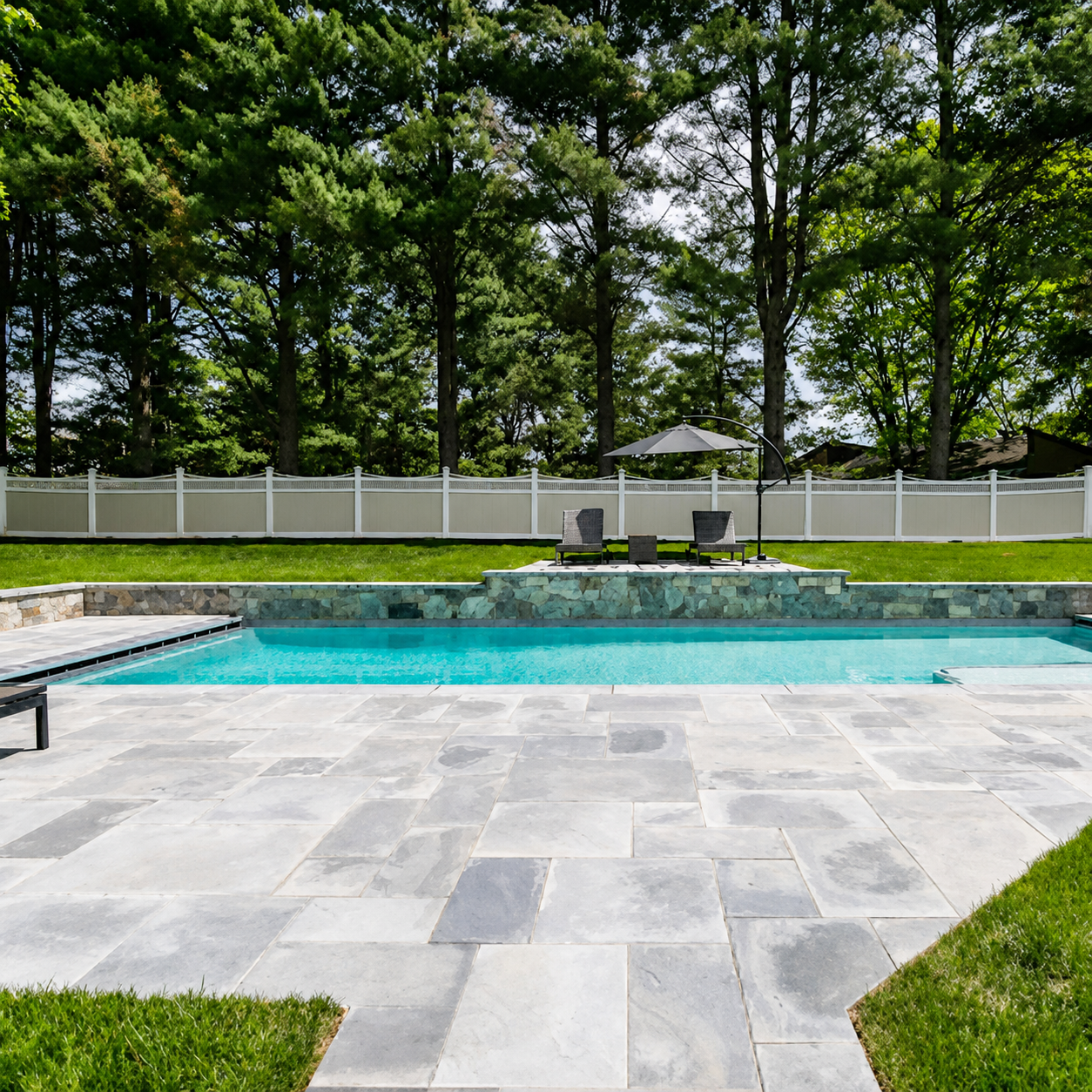 Finished Marblu stone pool deck in full sunlight