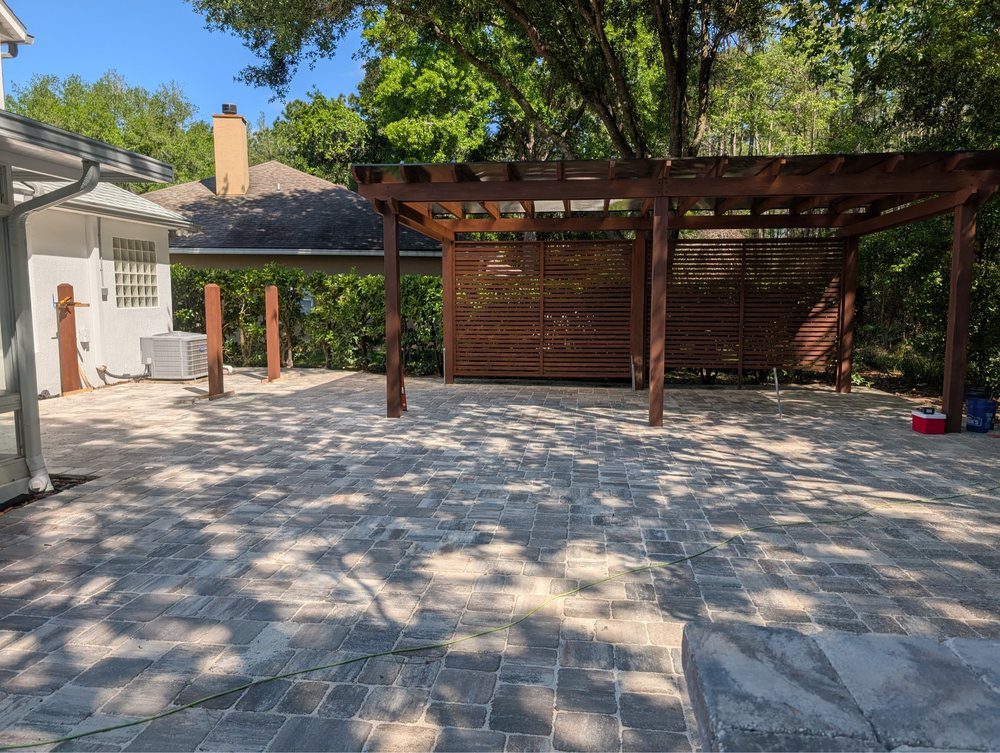 Large paver patio with timber pergola built by Marblu